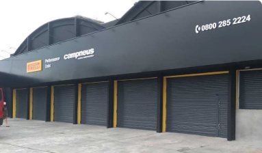 Campneus e Nossa Parceria de Sucesso com Portas de Enrolar Elétricas